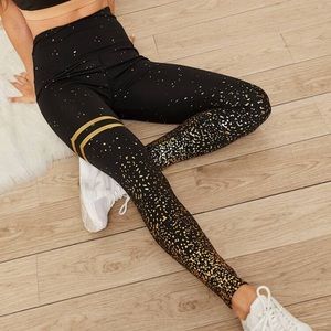 Black workout leggings with gold detail